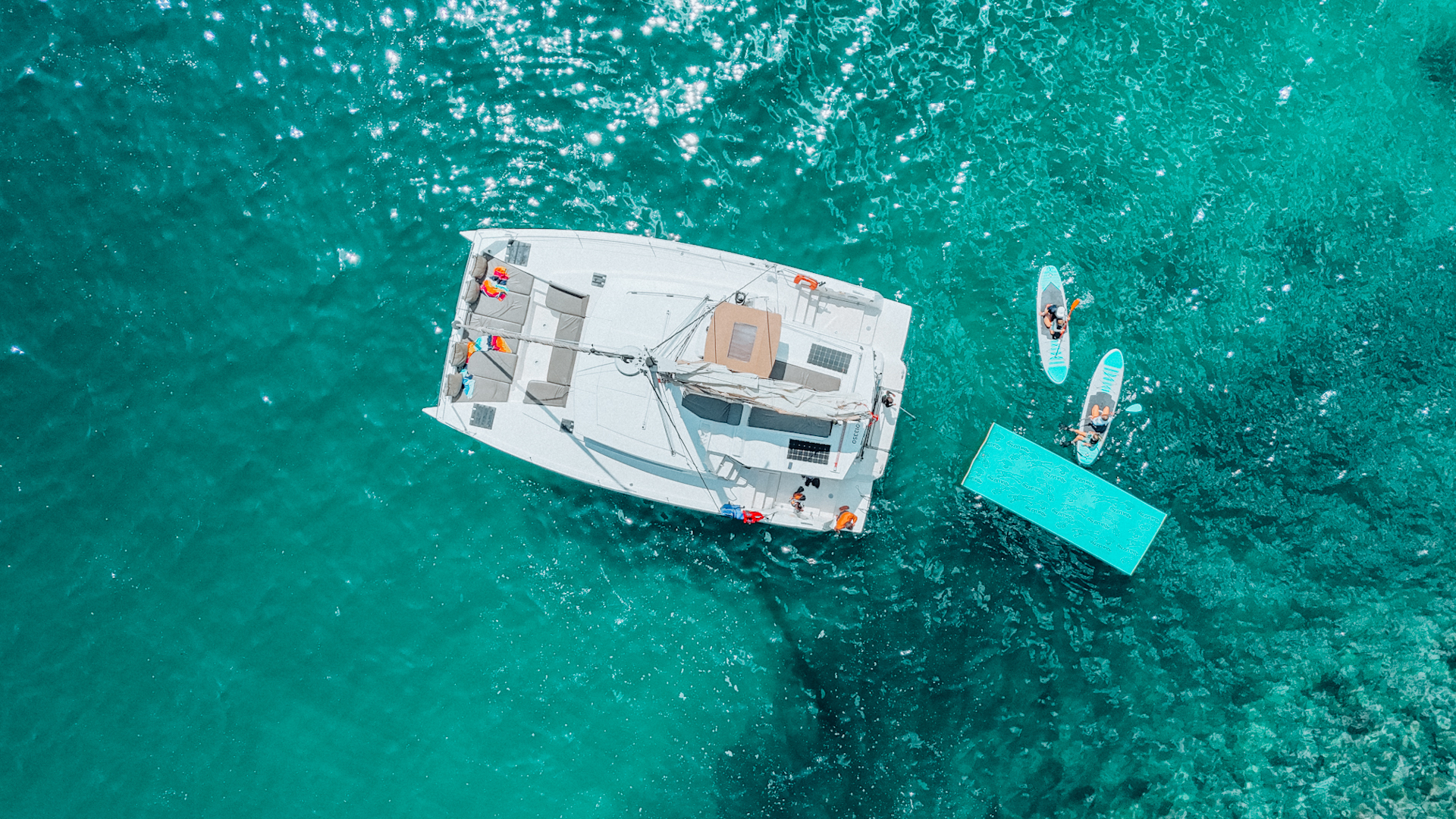 Aerial view of catamaran and paddleboards.